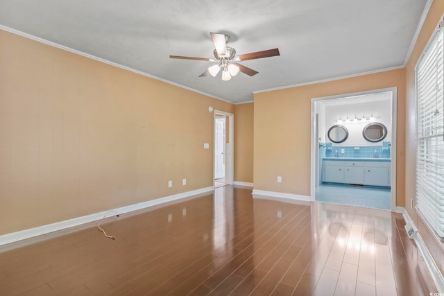 1043 S Main St, Aynor, SC 29511 - unfurnished room with a ceiling fan, baseboards, wood finished floors, and crown molding