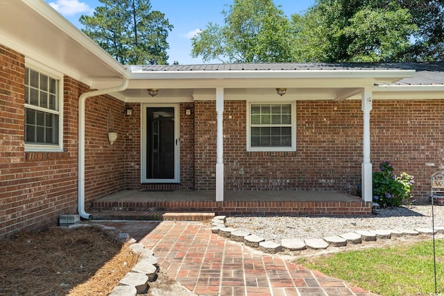 1043 S Main St, Aynor, SC 29511 - property entrance with brick siding and metal roof