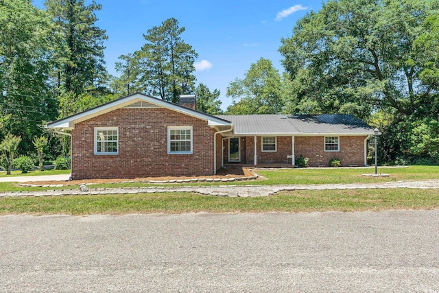 1043 S Main St, Aynor, SC 29511 - single story home with a front yard and brick siding