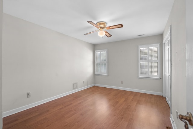 578 Circle Dr, Myrtle Beach, SC 29575 - unfurnished room with ceiling fan, healthy amount of natural light, wood finished floors, and baseboards
