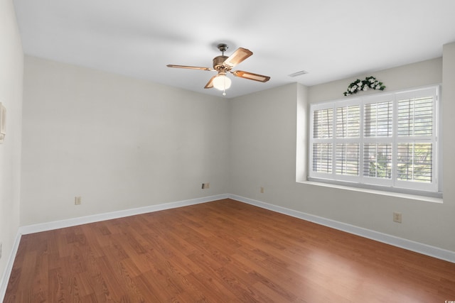 578 Circle Dr, Myrtle Beach, SC 29575 - spare room featuring a ceiling fan, wood finished floors, and baseboards