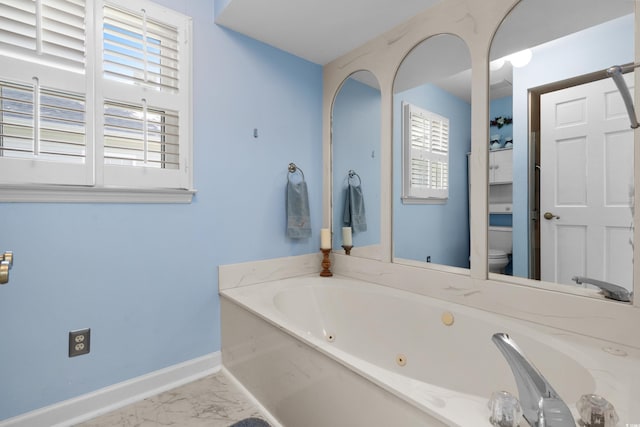 578 Circle Dr, Myrtle Beach, SC 29575 - full bath featuring a jetted tub, toilet, baseboards, and marble look tiles