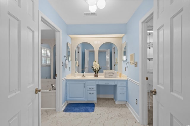 578 Circle Dr, Myrtle Beach, SC 29575 - full bathroom featuring vanity, marble look tile flooring, a bath, and baseboards