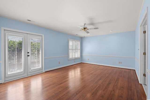 578 Circle Dr, Myrtle Beach, SC 29575 - unfurnished room featuring plenty of natural light, a ceiling fan, wood finished floors, and baseboards