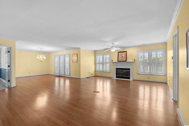 578 Circle Dr, Myrtle Beach, SC 29575 - unfurnished living room featuring ceiling fan, wood finished floors, a chandelier, a fireplace with flush hearth, and crown molding