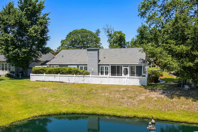 578 Circle Dr, Myrtle Beach, SC 29575 - back of house featuring a sunroom, roof with shingles, and a water view