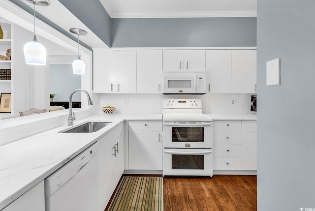 179 Golden Bear Dr Unit C4, Pawleys Island, SC 29585 - kitchen with white appliances, a sink, crown molding, white cabinets, and dark wood finished floors