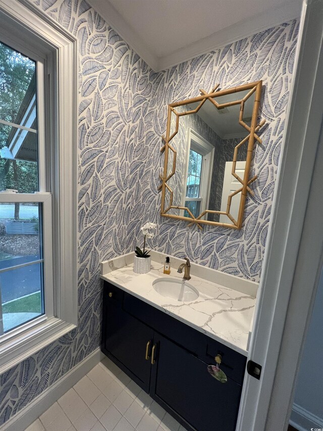 179 Golden Bear Dr Unit C4, Pawleys Island, SC 29585 - bathroom featuring wallpapered walls, vanity, baseboards, plenty of natural light, and tile patterned floors
