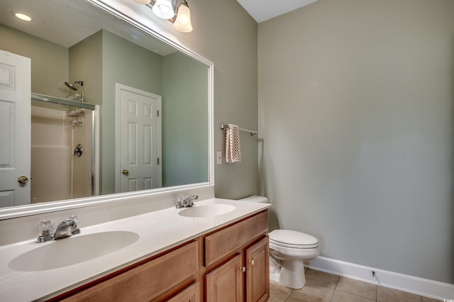 205 Threshing Way Unit 1052, Myrtle Beach, SC 29579 - bathroom with tile patterned flooring, a stall shower, double vanity, toilet, and baseboards