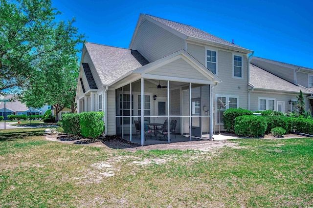 205 Threshing Way Unit 1052, Myrtle Beach, SC 29579 - back of property featuring a sunroom, ceiling fan, a lawn, and a shingled roof