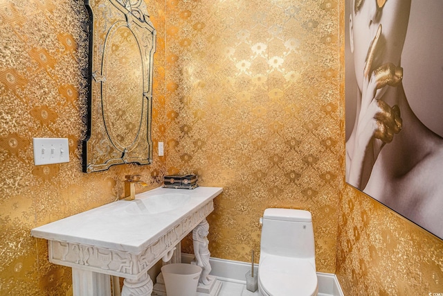 123 Pioneer Loop, Georgetown, SC 29440 - bathroom featuring a sink and wallpapered walls