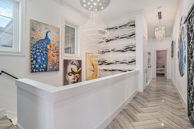123 Pioneer Loop, Georgetown, SC 29440 - hallway featuring a chandelier, an upstairs landing, and baseboards