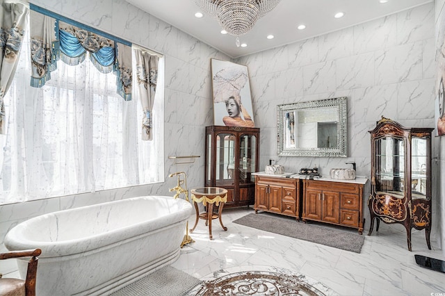 123 Pioneer Loop, Georgetown, SC 29440 - bathroom featuring recessed lighting, double vanity, marble tiled flooring, and a freestanding tub