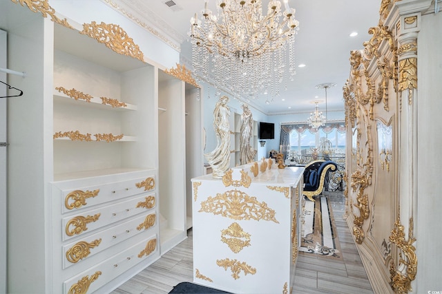 123 Pioneer Loop, Georgetown, SC 29440 - spacious closet with a chandelier and light wood-style flooring