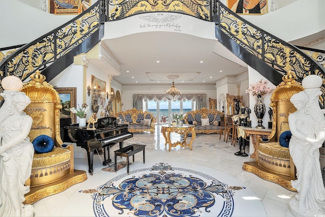 123 Pioneer Loop, Georgetown, SC 29440 - entrance foyer with stairs, ornamental molding, a towering ceiling, and a chandelier