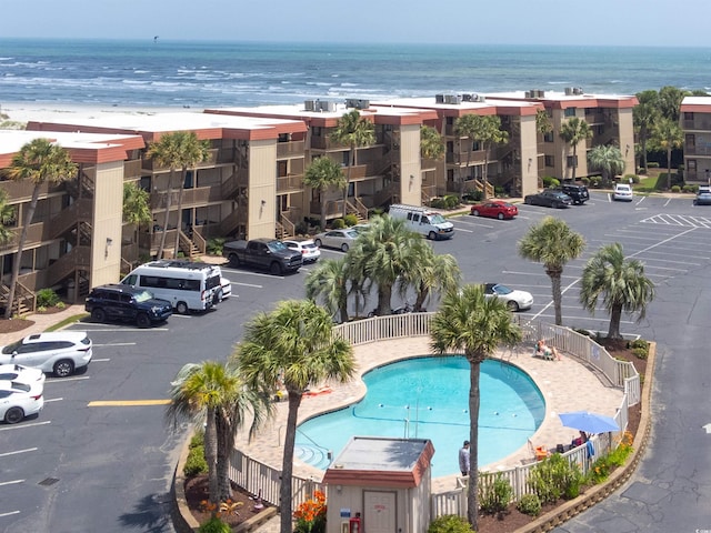 6309 N Ocean Blvd Unit 14E, North Myrtle Beach, SC 29582 - bird's eye view of a pool, a nearby body of water, and apartment complex / building