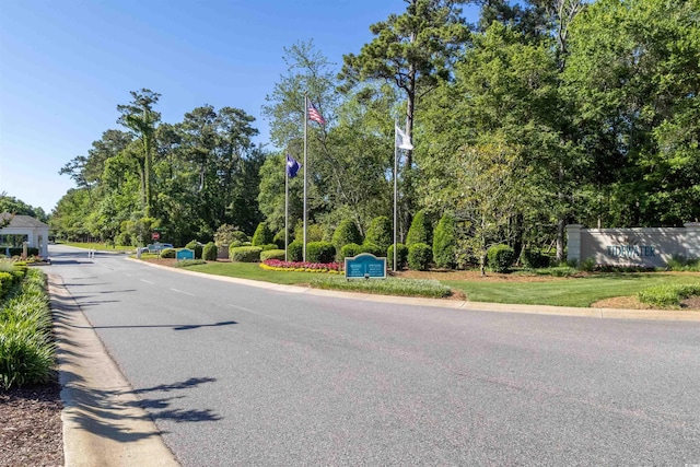 1221 Tidewater Dr Unit 2112, North Myrtle Beach, SC 29582 - view of asphalt road featuring view of wooded area