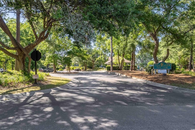 1221 Tidewater Dr Unit 2112, North Myrtle Beach, SC 29582 - view of asphalt road with traffic signs and curbs