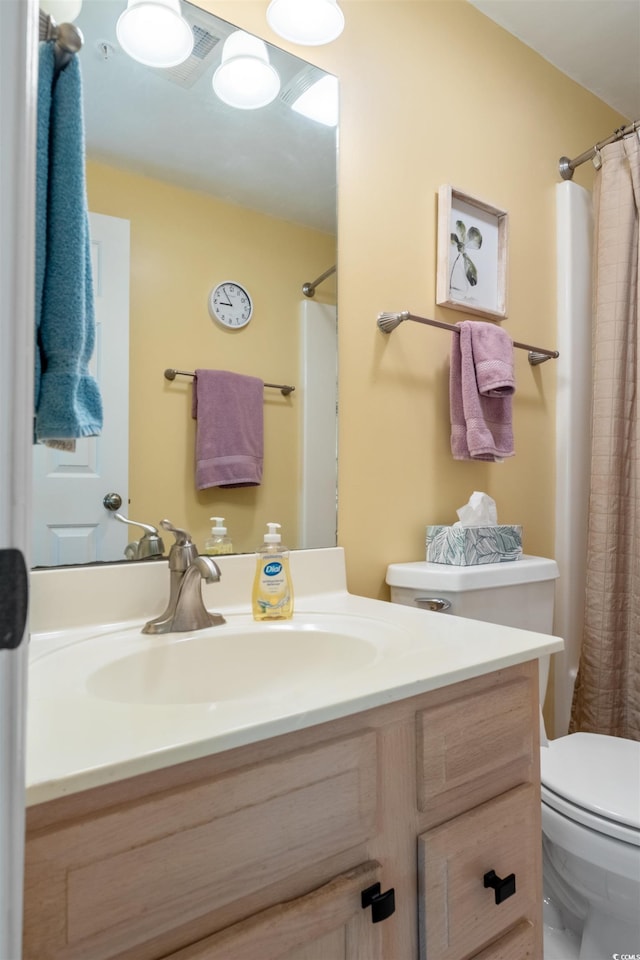 1221 Tidewater Dr Unit 2112, North Myrtle Beach, SC 29582 - bathroom featuring toilet, vanity, and a shower with curtain