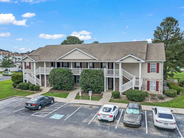 3676 Clay Pond Village Ln Unit 4, Myrtle Beach, SC 29579 - view of building exterior with stairway and uncovered parking