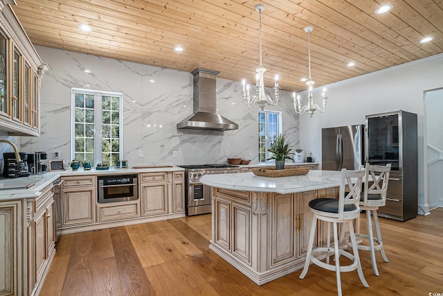 139 Pioneer Loop, Georgetown, SC 29440 - kitchen with appliances with stainless steel finishes, wall chimney exhaust hood, wooden ceiling, light wood finished floors, and a chandelier