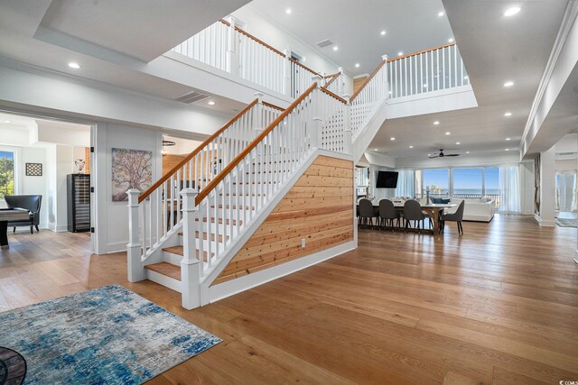 139 Pioneer Loop, Georgetown, SC 29440 - staircase with recessed lighting, a high ceiling, hardwood / wood-style flooring, and ceiling fan