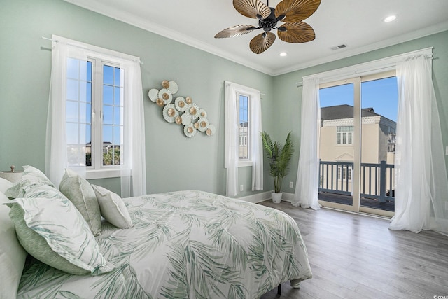 139 Pioneer Loop, Georgetown, SC 29440 - bedroom featuring access to exterior, multiple windows, wood finished floors, ornamental molding, and recessed lighting