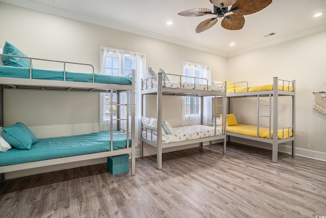 139 Pioneer Loop, Georgetown, SC 29440 - bedroom with wood finished floors, ornamental molding, recessed lighting, and ceiling fan