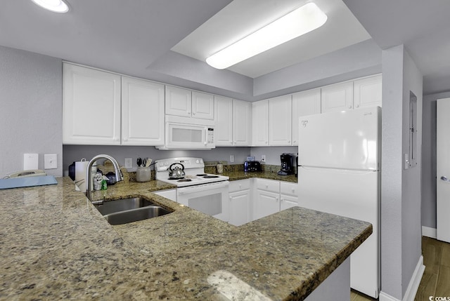 2504 N Ocean Blvd Unit 2030, Myrtle Beach, SC 29577 - kitchen with white appliances, dark stone countertops, white cabinets, and wood finished floors