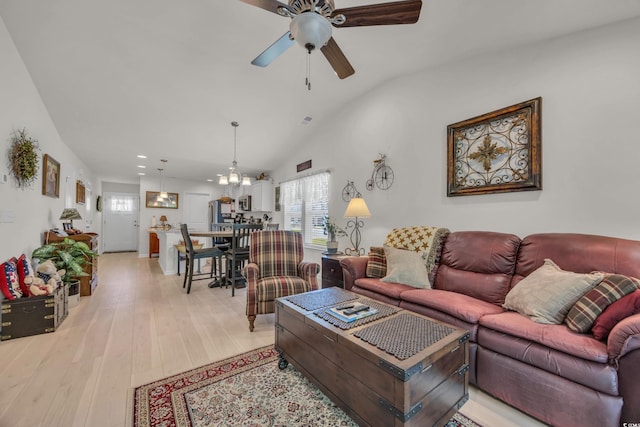 132 Machrie Loop Unit A, Myrtle Beach, SC 29588 - living room with a ceiling fan, a chandelier, lofted ceiling, recessed lighting, and light wood-type flooring