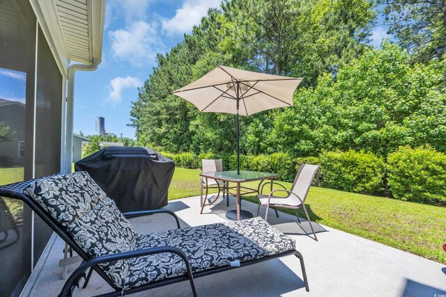 132 Machrie Loop Unit A, Myrtle Beach, SC 29588 - view of patio featuring area for grilling and outdoor dining space