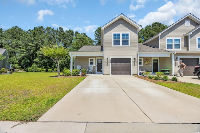 132 Machrie Loop Unit A, Myrtle Beach, SC 29588 - traditional-style house with a porch, a front lawn, an attached garage, driveway, and roof with shingles