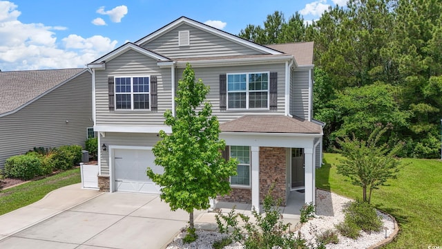 278 Carolina Crossing Blvd, Little River, SC 29566 - view of front of house featuring stone siding, a garage, concrete driveway, a shingled roof, and a front lawn