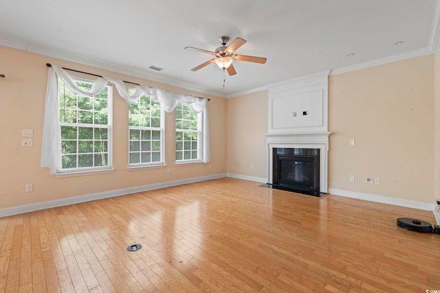 278 Carolina Crossing Blvd, Little River, SC 29566 - unfurnished living room with light wood-type flooring, ornamental molding, ceiling fan, and a fireplace