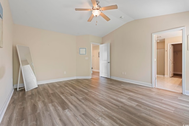 278 Carolina Crossing Blvd, Little River, SC 29566 - unfurnished bedroom featuring vaulted ceiling, wood finished floors, a ceiling fan, and a spacious closet