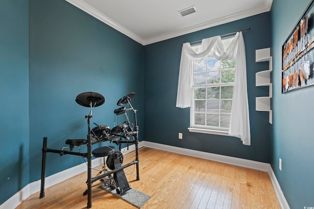 278 Carolina Crossing Blvd, Little River, SC 29566 - workout area with wood finished floors and ornamental molding