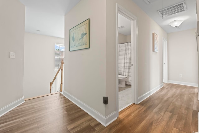 278 Carolina Crossing Blvd, Little River, SC 29566 - hall featuring wood finished floors, attic access, and an upstairs landing