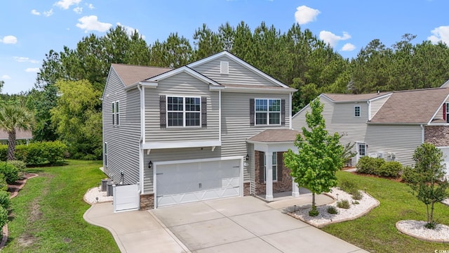 278 Carolina Crossing Blvd, Little River, SC 29566 - view of front of property featuring stone siding, concrete driveway, an attached garage, and a front yard