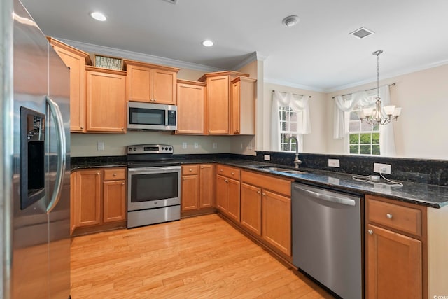 278 Carolina Crossing Blvd, Little River, SC 29566 - kitchen featuring appliances with stainless steel finishes, crown molding, a chandelier, a peninsula, and light wood-style floors