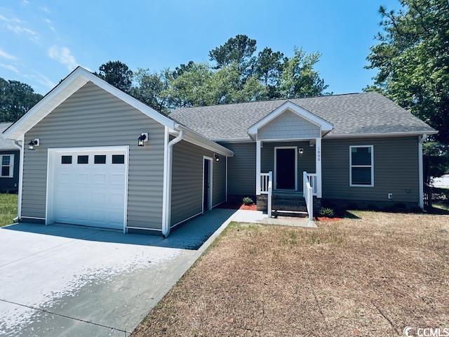1000 Weldon Ln, Conway, SC 29526 - ranch-style house with driveway, an attached garage, and a shingled roof