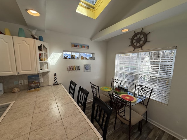 6001-Z67 S Kings Hwy, Myrtle Beach, SC 29575 - dining area featuring a skylight, vaulted ceiling, recessed lighting, and baseboards