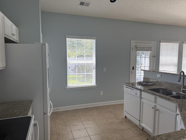 152 Rose Water Loop, Myrtle Beach, SC 29588 - kitchen with white appliances, a sink, white cabinets, light tile patterned flooring, and a textured ceiling
