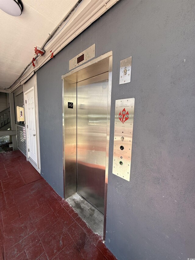 1509 N Waccamaw Dr Unit 112, Murrells Inlet, SC 29576 - corridor featuring elevator