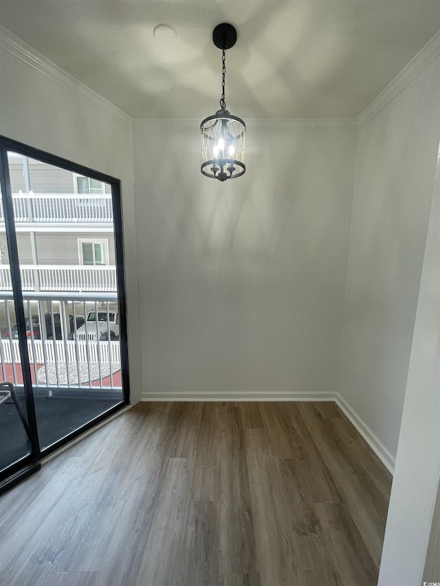 1509 N Waccamaw Dr Unit 112, Murrells Inlet, SC 29576 - spare room with a chandelier, wood finished floors, baseboards, and ornamental molding
