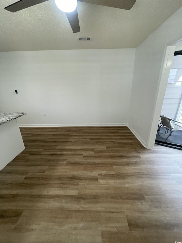 1509 N Waccamaw Dr Unit 112, Murrells Inlet, SC 29576 - unfurnished dining area featuring a ceiling fan, wood finished floors, and baseboards