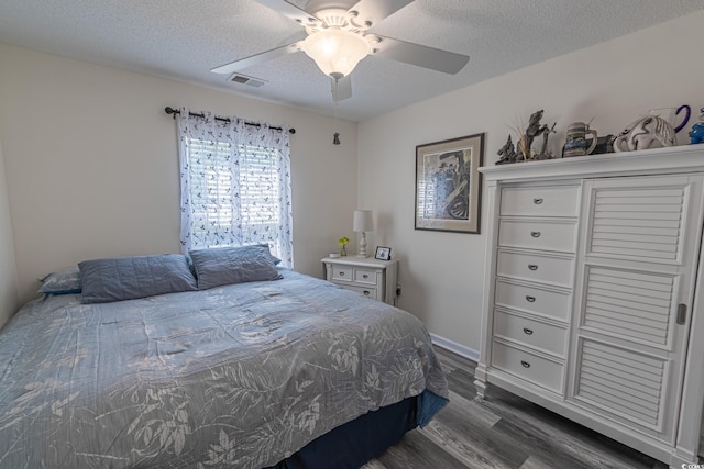 359 Harbour Reef Dr, Myrtle Beach, SC 29588 - bedroom with dark wood-type flooring, a textured ceiling, and ceiling fan
