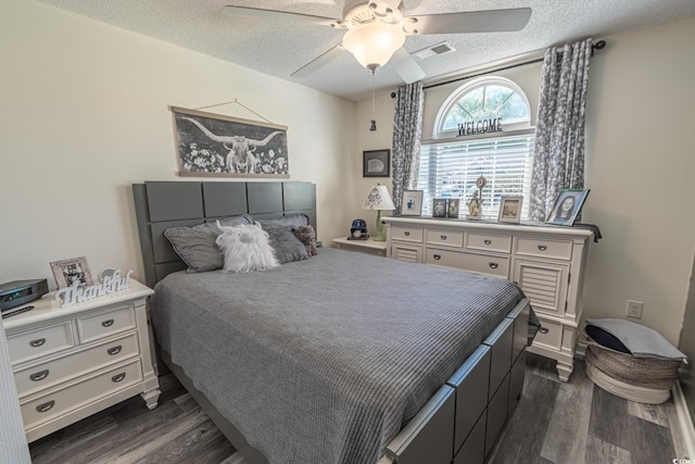 359 Harbour Reef Dr, Myrtle Beach, SC 29588 - bedroom with dark wood-style floors, a textured ceiling, and a ceiling fan