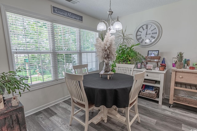 359 Harbour Reef Dr, Myrtle Beach, SC 29588 - dining room featuring a chandelier, wood finished floors, baseboards, and a textured ceiling