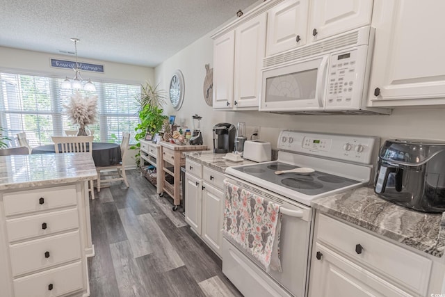 359 Harbour Reef Dr, Myrtle Beach, SC 29588 - kitchen featuring white appliances, dark wood finished floors, white cabinets, a textured ceiling, and decorative light fixtures