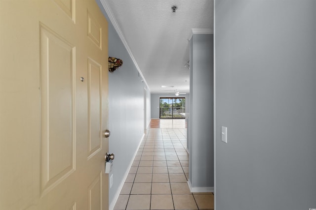 4350 Intercoastal Dr Unit 2408, Little River, SC 29566 - hallway with baseboards, light tile patterned floors, crown molding, and a textured ceiling